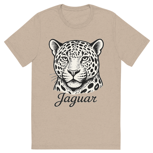 Front view of a Premium Tri-Blend Crew Neck T-Shirt in Tan showing 'A flat, neutral graphic of a bold sketch of a jaguar with large rosettes and strong jawline. “jaguar” appears in elegant script below. white background, fine linework.'