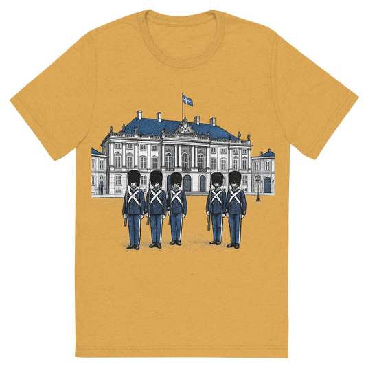 Front view of a Premium Tri-Blend Crew Neck T-Shirt in Mustard showing 'A hand-drawn ink with pop color, formal graphic of a refined ink-style illustration of amalienborg palace with danish guards in front and the words “amalienborg palace” in gold-trim lettering above. transparent background, centered layout, royal blue and gray pops. optimized for dtg.'
