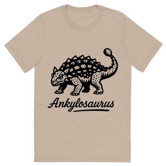 Front view of a Premium Tri-Blend Crew Neck T-Shirt in Tan showing 'A flat, neutral graphic of a bold ink drawing of an ankylosaurus with armored plates and a clubbed tail. “ankylosaurus” is inscribed below in script. ink illustration on a white background.'