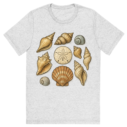 Front view of a Premium Tri-Blend Crew Neck T-Shirt in White Fleck showing 'A hand-drawn ink with pops of color, natural graphic of a hand-drawn collection of various seashells (conch, scallop, spiral, sand dollar) arranged artistically, ink with pops of color, square layout, transparent background, optimized for dtg printing'