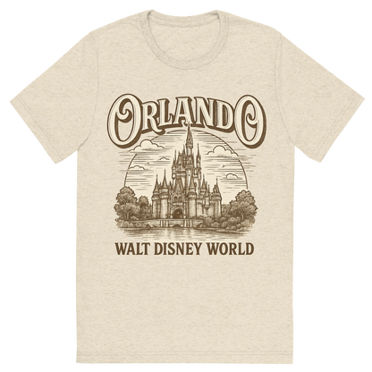Front view of a Premium Tri-Blend Crew Neck T-Shirt in Oatmeal showing 'A typographic, nostalgic graphic of a typographic illustration of the words 'orlando' with a vintage line art drawing of the walt disney world'