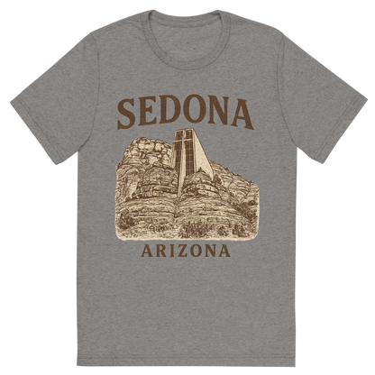Front view of a Premium Tri-Blend Crew Neck T-Shirt in Grey showing 'A typographic, nostalgic graphic of a typographic illustration of the words 'sedona, arizona' with a vintage line art drawing of the chapel of the holy cross'