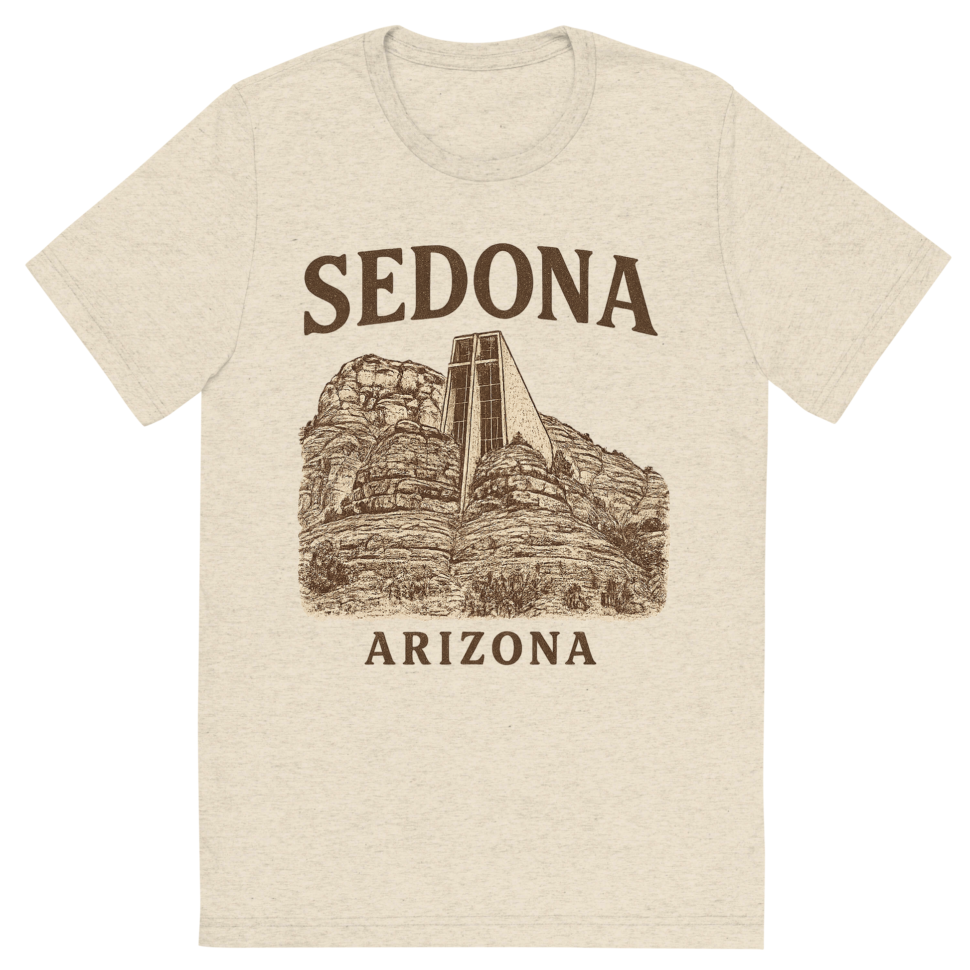 Front view of a Premium Tri-Blend Crew Neck T-Shirt in Oatmeal showing 'A typographic, nostalgic graphic of a typographic illustration of the words 'sedona, arizona' with a vintage line art drawing of the chapel of the holy cross'