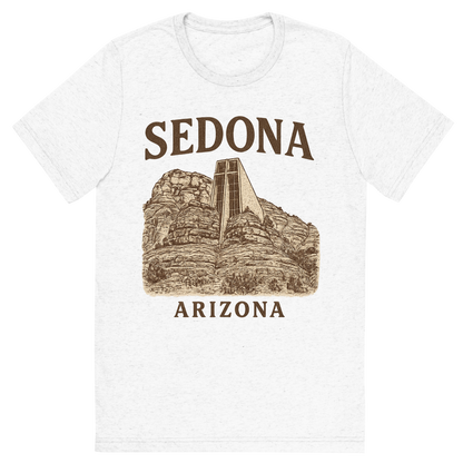 Front view of a Premium Tri-Blend Crew Neck T-Shirt in Solid White showing 'A typographic, nostalgic graphic of a typographic illustration of the words 'sedona, arizona' with a vintage line art drawing of the chapel of the holy cross'