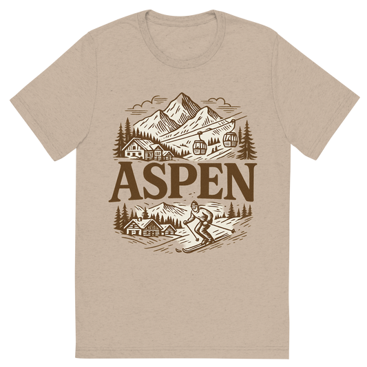 Front view of a Premium Tri-Blend Crew Neck T-Shirt in Tan showing 'A typographic, nostalgic graphic of a typographic illustration of the words 'aspen' with a vintage line art drawing of ski resorts'