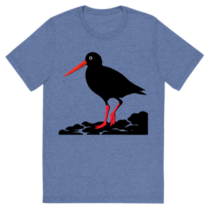 Front view of a Premium Tri-Blend Crew Neck T-Shirt in Blue showing 'A high-contrast silhouette with minimal accent color, striking graphic of a stylized silhouette of an american oystercatcher standing on a rocky shore, long orange bill and pink legs highlighted with color, high contrast silhouette, transparent background, centered composition, optimized for dtg printing'