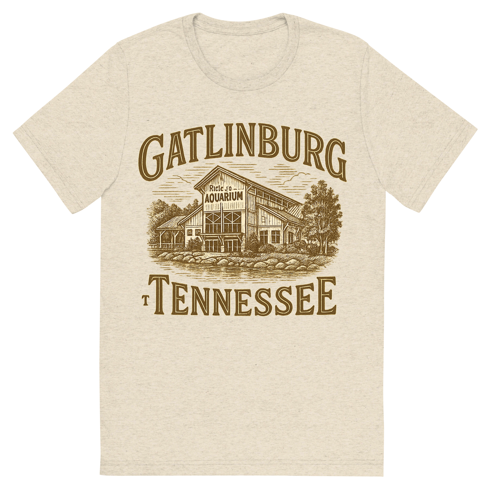 Front view of a Premium Tri-Blend Crew Neck T-Shirt in Oatmeal showing 'A typographic, nostalgic graphic of a typographic illustration of the words 'gatlinburg, tennessee' with a vintage line art drawing of ripley’s aquarium'