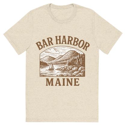 Front view of a Premium Tri-Blend Crew Neck T-Shirt in Oatmeal showing 'A typographic, nostalgic graphic of a typographic illustration of the words 'bar harbor, maine' with a vintage line art drawing of acadia national park'