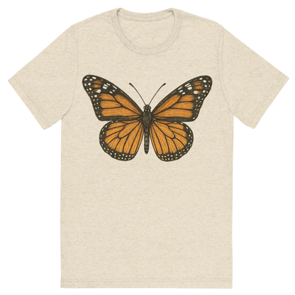 Front view of a Premium Tri-Blend Crew Neck T-Shirt in Oatmeal showing 'A hand-drawn, tranquil graphic of monarch butterfly'