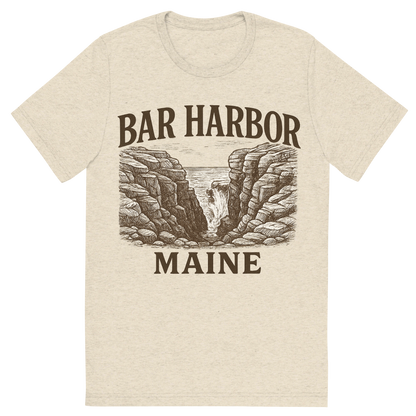 Front view of a Premium Tri-Blend Crew Neck T-Shirt in Oatmeal showing 'A typographic, nostalgic graphic of a typographic illustration of the words 'bar harbor, maine' with a vintage line art drawing of thunder hole'