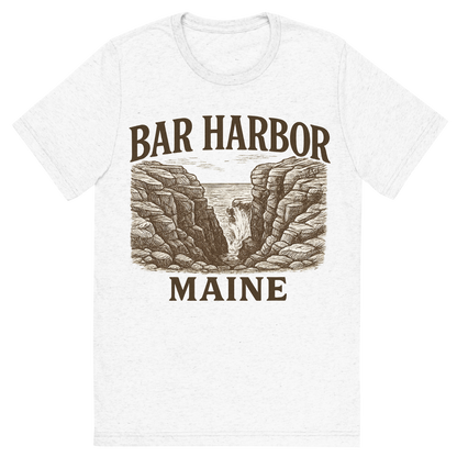 Front view of a Premium Tri-Blend Crew Neck T-Shirt in Solid White showing 'A typographic, nostalgic graphic of a typographic illustration of the words 'bar harbor, maine' with a vintage line art drawing of thunder hole'