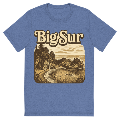 Front view of a Premium Tri-Blend Crew Neck T-Shirt in Blue showing 'A typographic, nostalgic graphic of a typographic illustration of the words 'big sur' with a vintage line art drawing of the mcway falls'