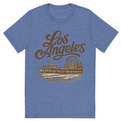 Front view of a Premium Tri-Blend Crew Neck T-Shirt in Blue showing 'A typographic, nostalgic graphic of a typographic illustration of the words 'los angeles' with a vintage line art drawing of santa monica pier'