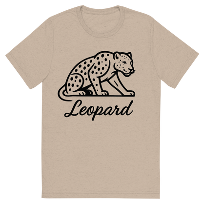 Front view of a Premium Tri-Blend Crew Neck T-Shirt in Tan showing 'A flat, neutral graphic of a minimalist drawing of a leopard crouched, with visible spots and muscular build. “leopard” is written beneath in flowing script. black ink on white.'