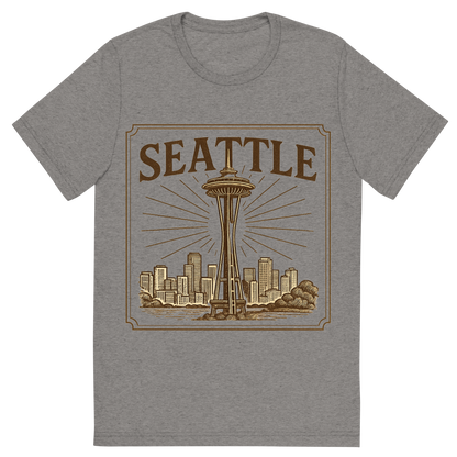 Front view of a Premium Tri-Blend Crew Neck T-Shirt in Grey showing 'A typographic, nostalgic graphic of a typographic illustration of the words 'seattle' with a vintage line art drawing of the space needle'