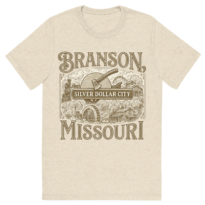 Front view of a Premium Tri-Blend Crew Neck T-Shirt in Oatmeal showing 'A typographic, nostalgic graphic of a typographic illustration of the words 'branson, missouri' with a vintage line art drawing of the silver dollar city'