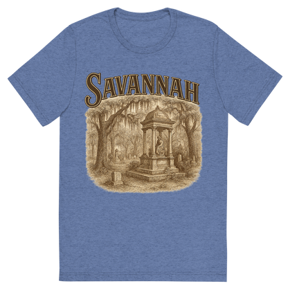 Front view of a Premium Tri-Blend Crew Neck T-Shirt in Blue showing 'A typographic, nostalgic graphic of a typographic illustration of the words 'savannah' with a vintage line art drawing of the bonaventure cemetery'