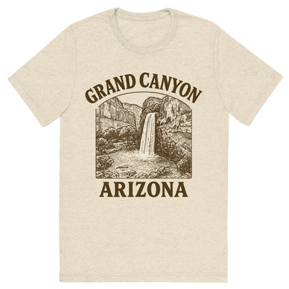 Front view of a Premium Tri-Blend Crew Neck T-Shirt in Oatmeal showing 'A typographic, nostalgic graphic of a typographic illustration of the words 'grand canyon, arizona' with a vintage line art drawing of the havasu falls'