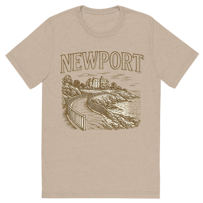 Front view of a Premium Tri-Blend Crew Neck T-Shirt in Tan showing 'A typographic, nostalgic graphic of a typographic illustration of the words 'newport' with a vintage line art drawing of the cliff walk'