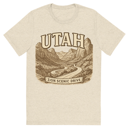Front view of a Premium Tri-Blend Crew Neck T-Shirt in Oatmeal showing 'A typographic, nostalgic graphic of a typographic illustration of the words 'utah' with a vintage line art drawing of the zion scenic drive'
