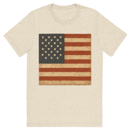 Front view of a Premium Tri-Blend Crew Neck T-Shirt in Oatmeal showing 'A retro, rustic graphic of a stylized version of the american flag'
