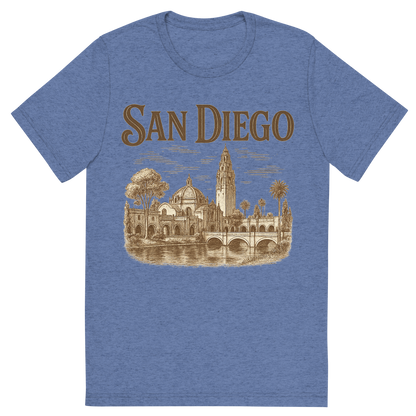 Front view of a Premium Tri-Blend Crew Neck T-Shirt in Blue showing 'A typographic, nostalgic graphic of a typographic illustration of the words 'san diego' with a vintage line art drawing of balboa park'