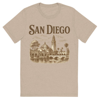 Front view of a Premium Tri-Blend Crew Neck T-Shirt in Tan showing 'A typographic, nostalgic graphic of a typographic illustration of the words 'san diego' with a vintage line art drawing of balboa park'