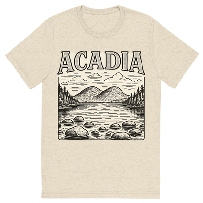 Front view of a Premium Tri-Blend Crew Neck T-Shirt in Oatmeal showing 'A typographic, nostalgic graphic of a typographic illustration of the words 'acadia' with a vintage line art drawing of jordan pond'