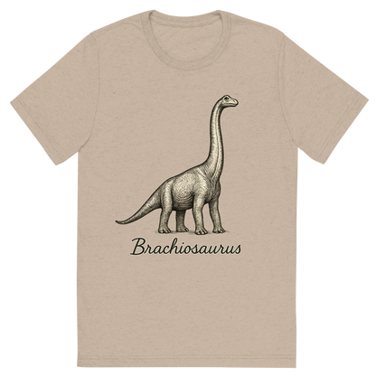 Front view of a Premium Tri-Blend Crew Neck T-Shirt in Tan showing 'A flat, neutral graphic of a towering brachiosaurus drawn with long neck reaching upward. “brachiosaurus” appears in elegant handwriting below. ink illustration on a white background.'
