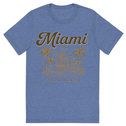 Front view of a Premium Tri-Blend Crew Neck T-Shirt in Blue showing 'A typographic, nostalgic graphic of a typographic illustration of the words 'miami' with a vintage line art drawing of south beach'