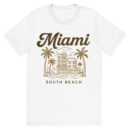 Front view of a Premium Tri-Blend Crew Neck T-Shirt in Solid White showing 'A typographic, nostalgic graphic of a typographic illustration of the words 'miami' with a vintage line art drawing of south beach'