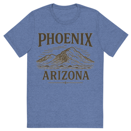 Front view of a Premium Tri-Blend Crew Neck T-Shirt in Blue showing 'A typographic, nostalgic graphic of a typographic illustration of the words 'phoenix, arizona' with a vintage line art drawing of camelback mountain'