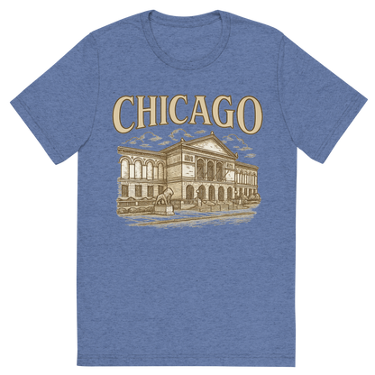 Front view of a Premium Tri-Blend Crew Neck T-Shirt in Blue showing 'A typographic, nostalgic graphic of a typographic illustration of the words 'chicago' with a vintage line art drawing of the art institute of chicago'