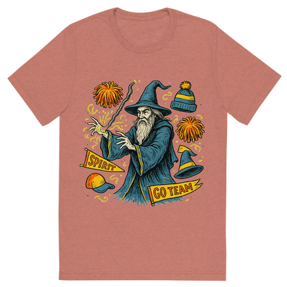 Front view of a Premium Tri-Blend Crew Neck T-Shirt in Mauve showing 'A hand-drawn ink with pop color, whimsical graphic of a mystical wizard in school colors casting a spell with floating spirit week items (pom-poms, banners, hats), with the phrase “spirit week sorcerer” arched above. transparent background, centered, hand-drawn ink with magical color pops. dtg optimized.'