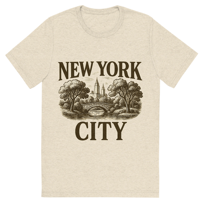 Front view of a Premium Tri-Blend Crew Neck T-Shirt in Oatmeal showing 'A typographic, nostalgic graphic of a typographic illustration of the words 'new york city' with a vintage line art drawing of central park'