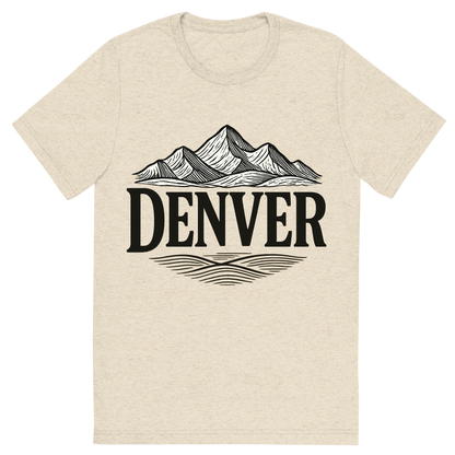 Front view of a Premium Tri-Blend Crew Neck T-Shirt in Oatmeal showing 'A typographic, nostalgic graphic of a typographic illustration of the words 'denver' with a vintage line art drawing of the rocky mountains'