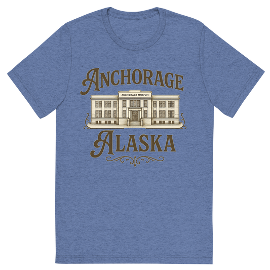 Front view of a Premium Tri-Blend Crew Neck T-Shirt in Blue showing 'A typographic, nostalgic graphic of a typographic illustration of the words 'anchorage, alaska' with a vintage line art drawing of the anchorage museum'