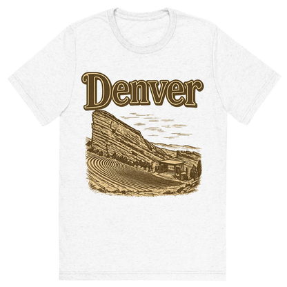 Front view of a Premium Tri-Blend Crew Neck T-Shirt in Solid White showing 'A typographic, nostalgic graphic of a typographic illustration of the words 'denver' with a vintage line art drawing of the red rocks amphitheatre'