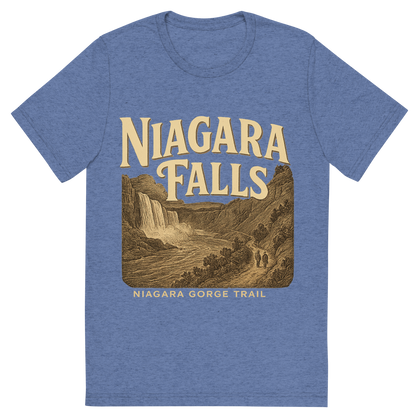 Front view of a Premium Tri-Blend Crew Neck T-Shirt in Blue showing 'A typographic, nostalgic graphic of a typographic illustration of the words 'niagara falls' with a vintage line art drawing of the niagara gorge trail'