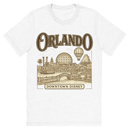 Front view of a Premium Tri-Blend Crew Neck T-Shirt in Solid White showing 'A typographic, nostalgic graphic of a typographic illustration of the words 'orlando' with a vintage line art drawing of downtown disney'