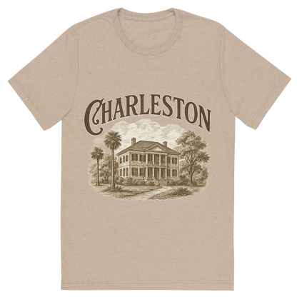 Front view of a Premium Tri-Blend Crew Neck T-Shirt in Tan showing 'A typographic, nostalgic graphic of a typographic illustration of the words 'charleston' with a vintage line art drawing of the historic plantations'