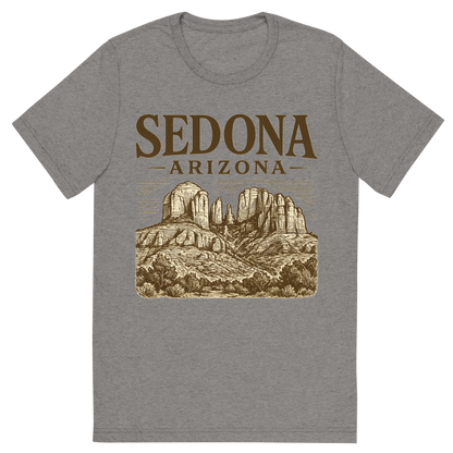 Front view of a Premium Tri-Blend Crew Neck T-Shirt in Grey showing 'A typographic, nostalgic graphic of a typographic illustration of the words 'sedona, arizona' with a vintage line art drawing of the red rock formations'