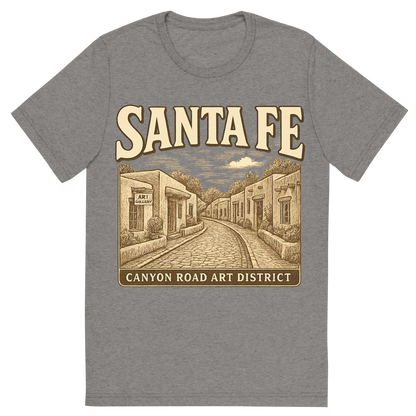 Front view of a Premium Tri-Blend Crew Neck T-Shirt in Grey showing 'A typographic, nostalgic graphic of a typographic illustration of the words 'santa fe' with a vintage line art drawing of the canyon road art district'