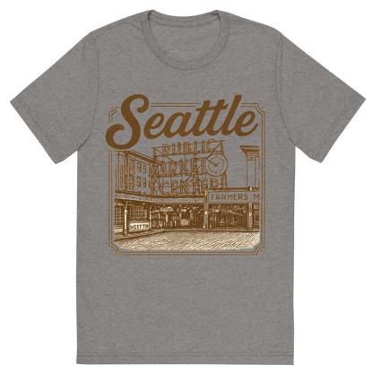 Front view of a Premium Tri-Blend Crew Neck T-Shirt in Grey showing 'A typographic, nostalgic graphic of a typographic illustration of the words 'seattle' with a vintage line art drawing of the pike place market'