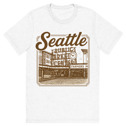Front view of a Premium Tri-Blend Crew Neck T-Shirt in Solid White showing 'A typographic, nostalgic graphic of a typographic illustration of the words 'seattle' with a vintage line art drawing of the pike place market'