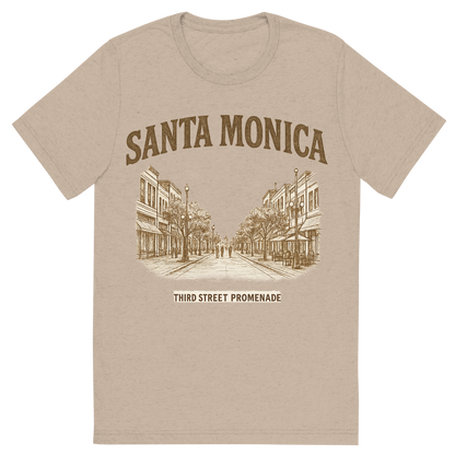 Front view of a Premium Tri-Blend Crew Neck T-Shirt in Tan showing 'A typographic, nostalgic graphic of a typographic illustration of the words 'santa monica' with a vintage line art drawing of the third street promenade'