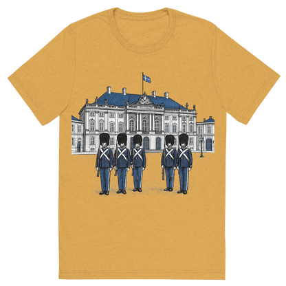 Front view of a Premium Tri-Blend Crew Neck T-Shirt in Mustard showing 'A hand-drawn ink with pop color, formal graphic of a refined ink-style illustration of amalienborg palace with danish guards in front and the words “amalienborg palace” in gold-trim lettering above. transparent background, centered layout, royal blue and gray pops. optimized for dtg.'