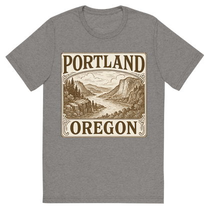 Front view of a Premium Tri-Blend Crew Neck T-Shirt in Grey showing 'A typographic, nostalgic graphic of a typographic illustration of the words 'portland, oregon' with a vintage line art drawing of the columbia river gorge'