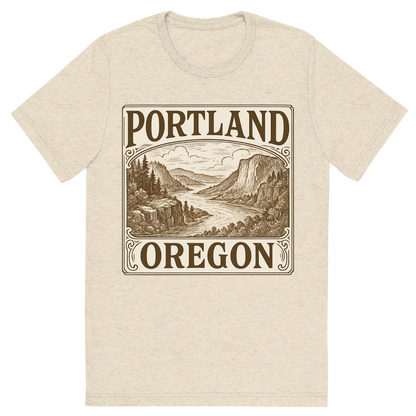 Front view of a Premium Tri-Blend Crew Neck T-Shirt in Oatmeal showing 'A typographic, nostalgic graphic of a typographic illustration of the words 'portland, oregon' with a vintage line art drawing of the columbia river gorge'