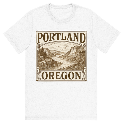 Front view of a Premium Tri-Blend Crew Neck T-Shirt in Solid White showing 'A typographic, nostalgic graphic of a typographic illustration of the words 'portland, oregon' with a vintage line art drawing of the columbia river gorge'